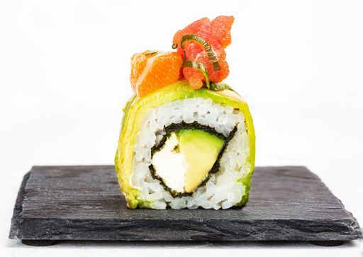 A closeup shot of delicious sushi roll on white background