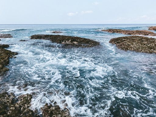 A beautiful view of the sea with splashing waves and rocks