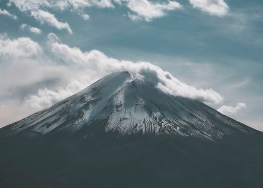 A beautiful shot of mountain Fuji in the background of the cloudy sky.