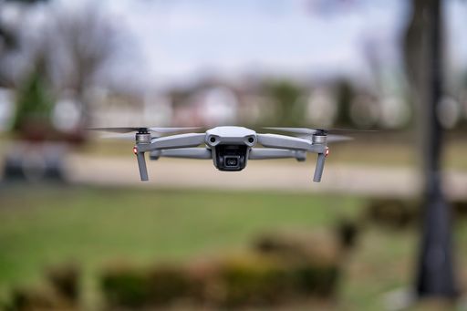 Close-up shot of an unmanned drone hovering in the air