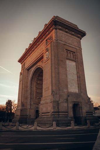 A vertical shot of the iconic architecture The Arch of Triumph in Bucharest, Romania