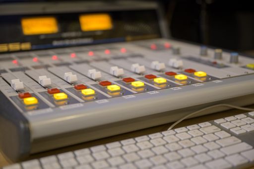 A closeup shot of professional radio station equipment or control panel
