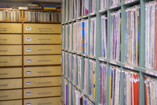 A large collection of vinyl and cassettes at a radio station storage