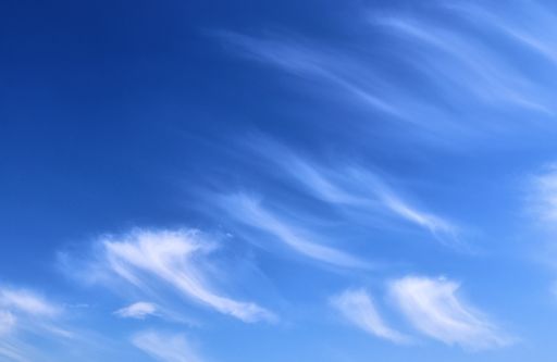 Beautiful and calming cirrus cloud formations in a deep blue summer sky.