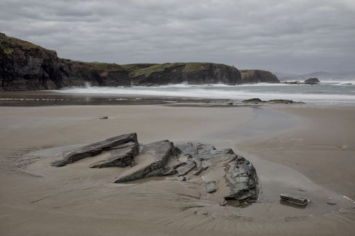 A nice view of the beautiful Os Castros Beach captured on a cloudy day in Ribadeo, Galicia, Spain