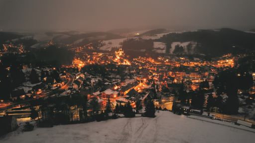 A mesmerizing shot of an old town during winter at night