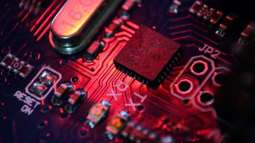 A closeup high angle shot of the lights and small pieces on an electronic board