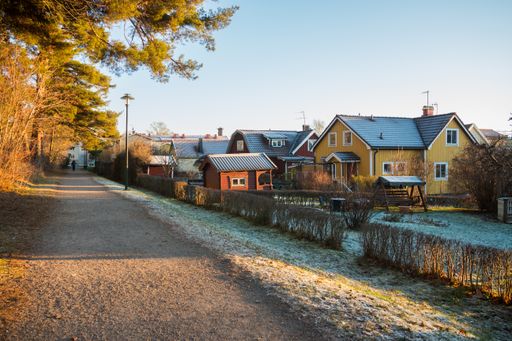 The view of the street with cozy wooden houses. Stockholm, Sweden.