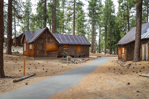 A bicycle path weaves through the site of an abandoned resort on the shore of Lake Tahoe.