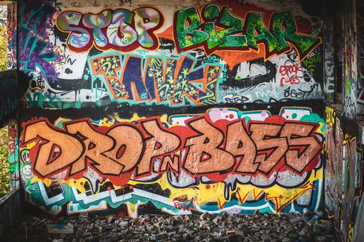 A view of an abandoned old police station covered in graffiti.