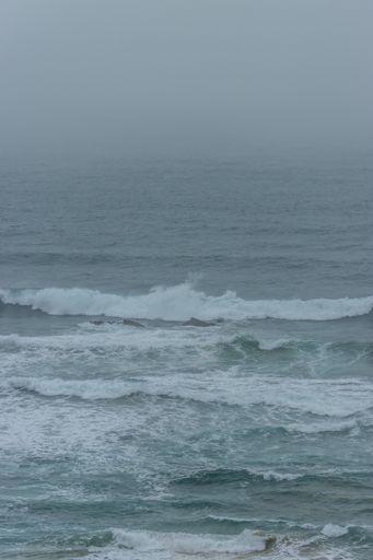 A vertical shot of the seashore on a cloudy day, Odeceixe, Portugal