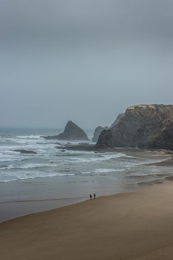 A vertical shot of the seashore on a cloudy day, Odeceixe, Portugal