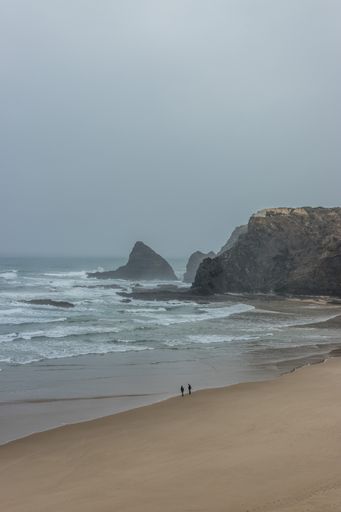A vertical shot of the seashore on a cloudy day, Odeceixe, Portugal