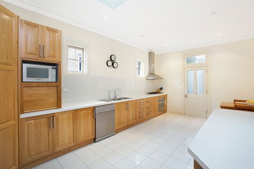 A kitchen interior with wooden furniture and kitchen accessories. Sydney, Australia, Real Estate