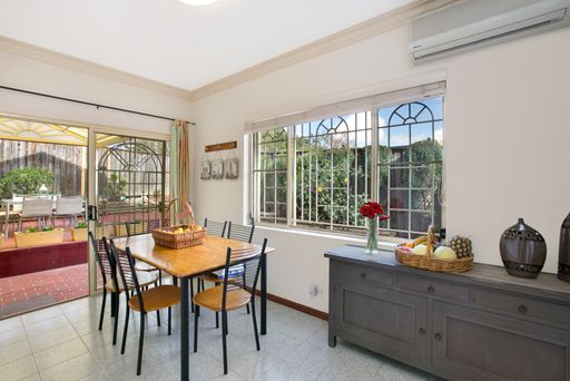 A classic dining room with creamy walls and tile floors. Sydney, Australia, Real Estate