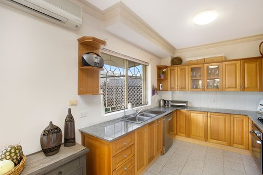 A kitchen with wooden furniture. Sydney, Australia, Real Estate