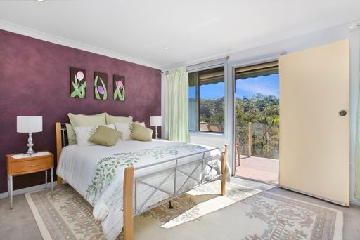 A bedroom interior with purple walls and balcony. Sydney, Australia, Real Estate