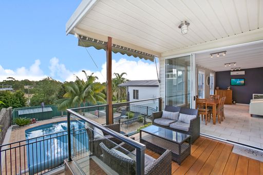 A back yard of a private house with terrace and swimming pool