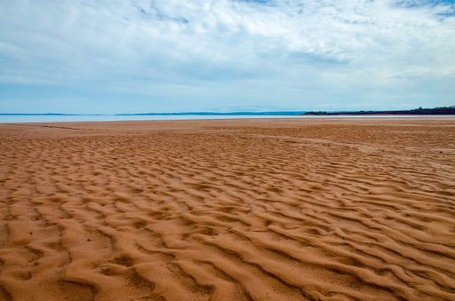 A beautiful shot of sand dunes in the daytime.