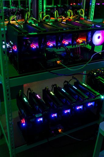 A vertical shot of brand new electronics in a warehouse with ultra colors