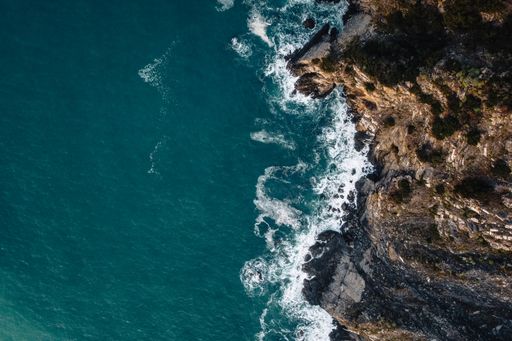 A beautiful drone shot of rocks near the coastline.