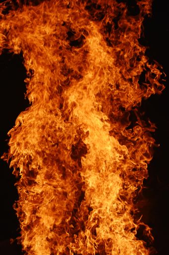 A vertical closeup shot of campfire at the time of festival