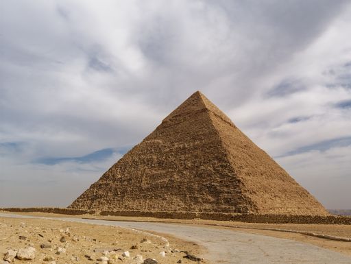 A photo of the Egyptian Pyramids and clouds in the sky
