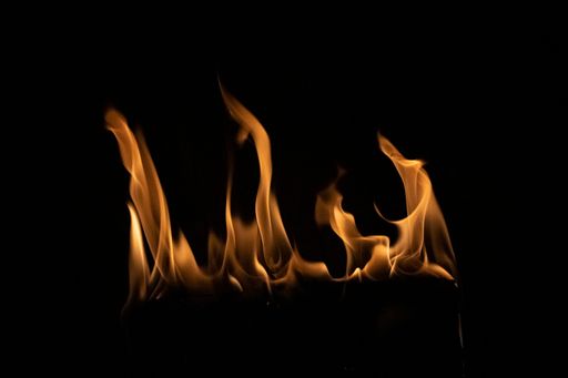 A closeup shot of a burning fire isolated on a black background
