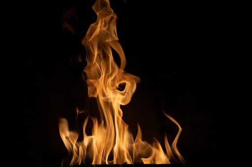 A closeup shot of a burning fire isolated on a black background