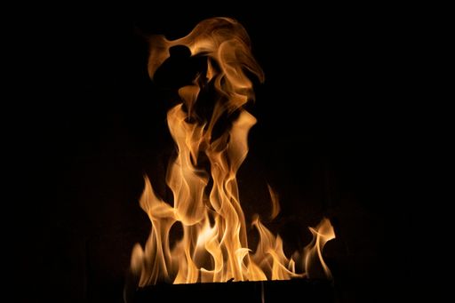 A closeup shot of a burning fire isolated on a black background