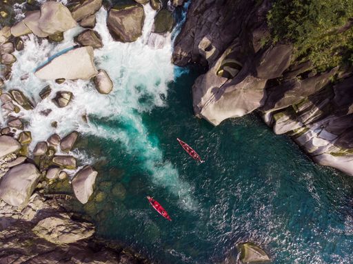 An aerial shot of boats in the Spiti river near Kaza, India