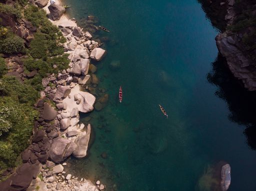 An aerial shot of boats in the Spiti river near Kaza, India