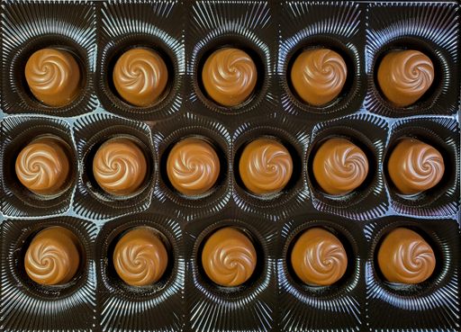 a top view of chocolate candies in the box