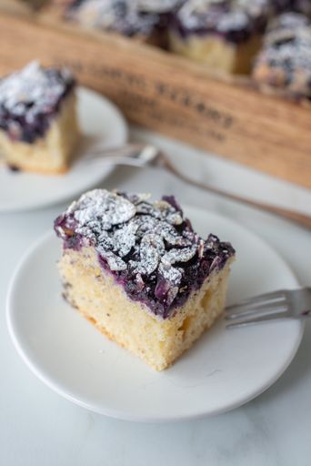 A vertical closeup shot of a piece of blueberry pie