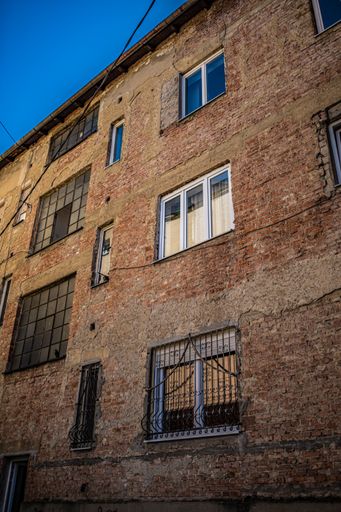 A vertical shot of a brick building facade