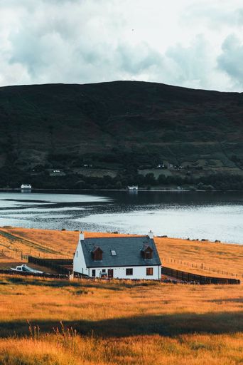 A vertical shot of a house in a rural area in the Isle of Skye in Scotland