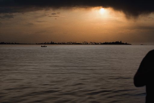 A photo of a silhouette of a person in San Juan, Puerto Rico, El Morro at sunset