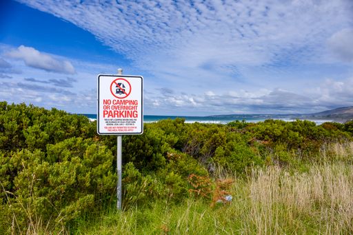 A no camping sign on the Ocean Road Roadside in Melbourne, Australia