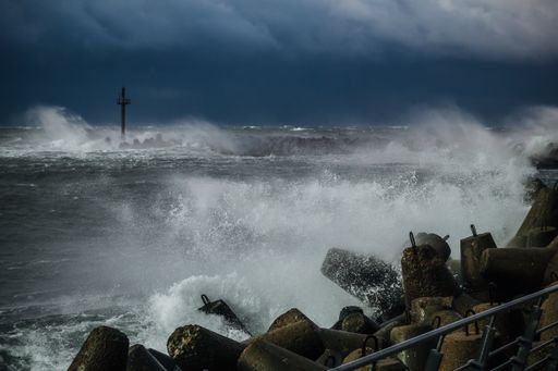 A Heavy storm at the gates to the port of Klaipeda, Lithuania. Baltic Sea against a gray cloudy sky
