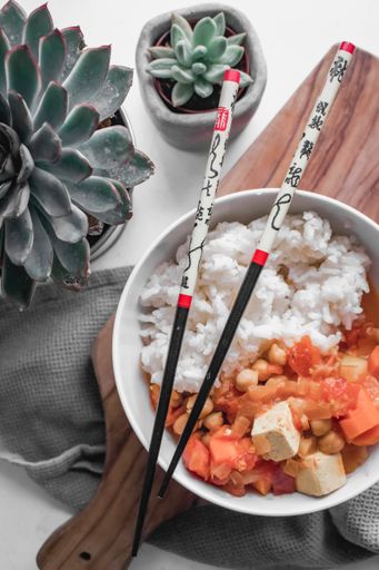 A vertical shot of Chinese food made with rice and veggies