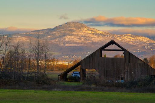 A Barn scene with Roxy Ann Peak in background in Rogue Valley during winter