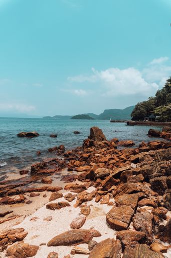 The rock formations on the beach in Rio on a sunny day