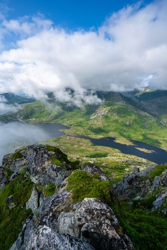 A mesmerizing view of river and mountains under a cloudy sky in Norway