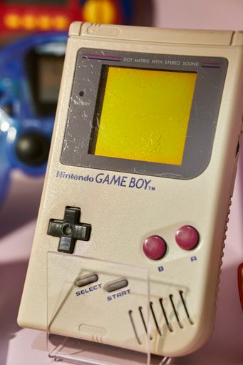 An exposition of a Nintendo Game Boy handheld game console in the toy museum
