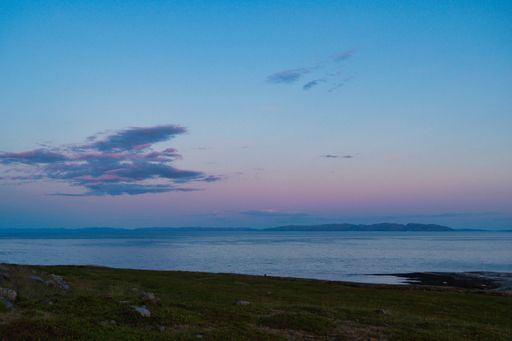 A beautiful shot of a fjord in Ekkeroy, Varanger, Norway at sunset