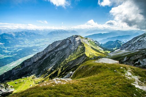 A mesmerizing Swiss Alps view from Mount Pilatus, Alpnach Switzerland on a cloudy sky