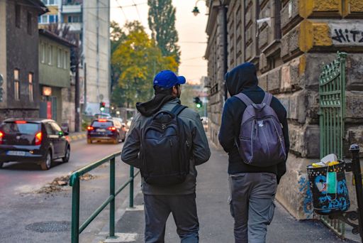 A back view of two man walking in the streets of Sarajevo, Bosnia and Herzegovina