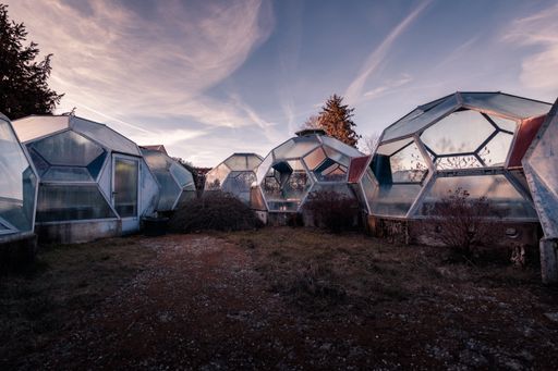 Dome greenhouses in the evening with a dramatic sky. Looks like a mission to mars. Sunset.