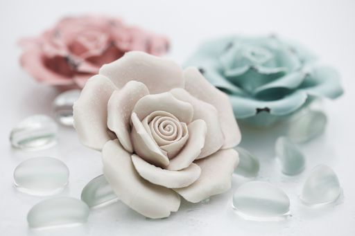 A Ceramic roses with transparent stones from glass