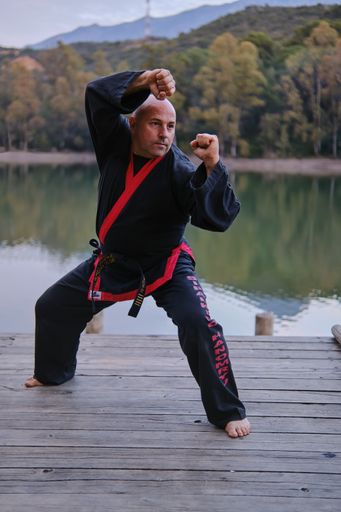 A vertical shot of Sipalkido master practicing in nature.